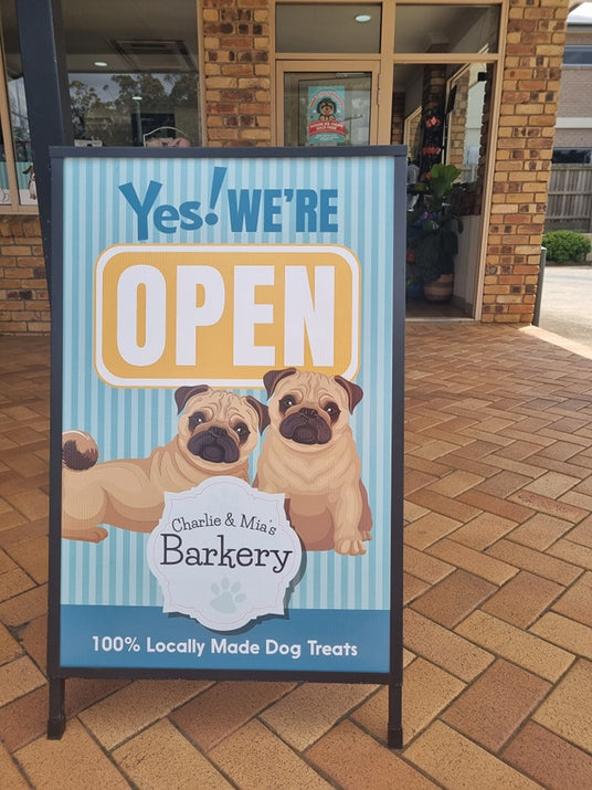 Yes! We're open sign for Charlie and Mia's Barkery